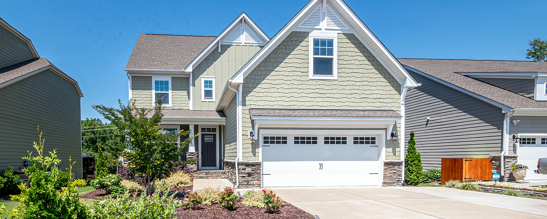 A view at suburban house with a large garage